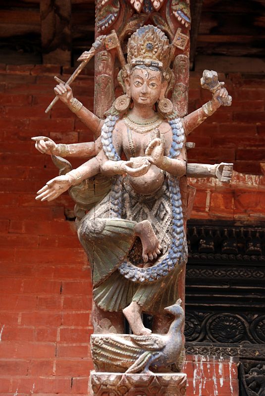 Kathmandu Patan Durbar Square Mul Chowk 24 Carved Wooden Roof Strut Of Many Armed Figure Standing On A Peacock 